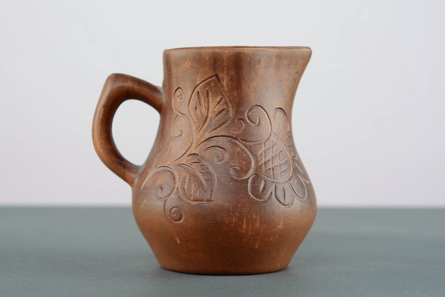 A small jug with patterns.