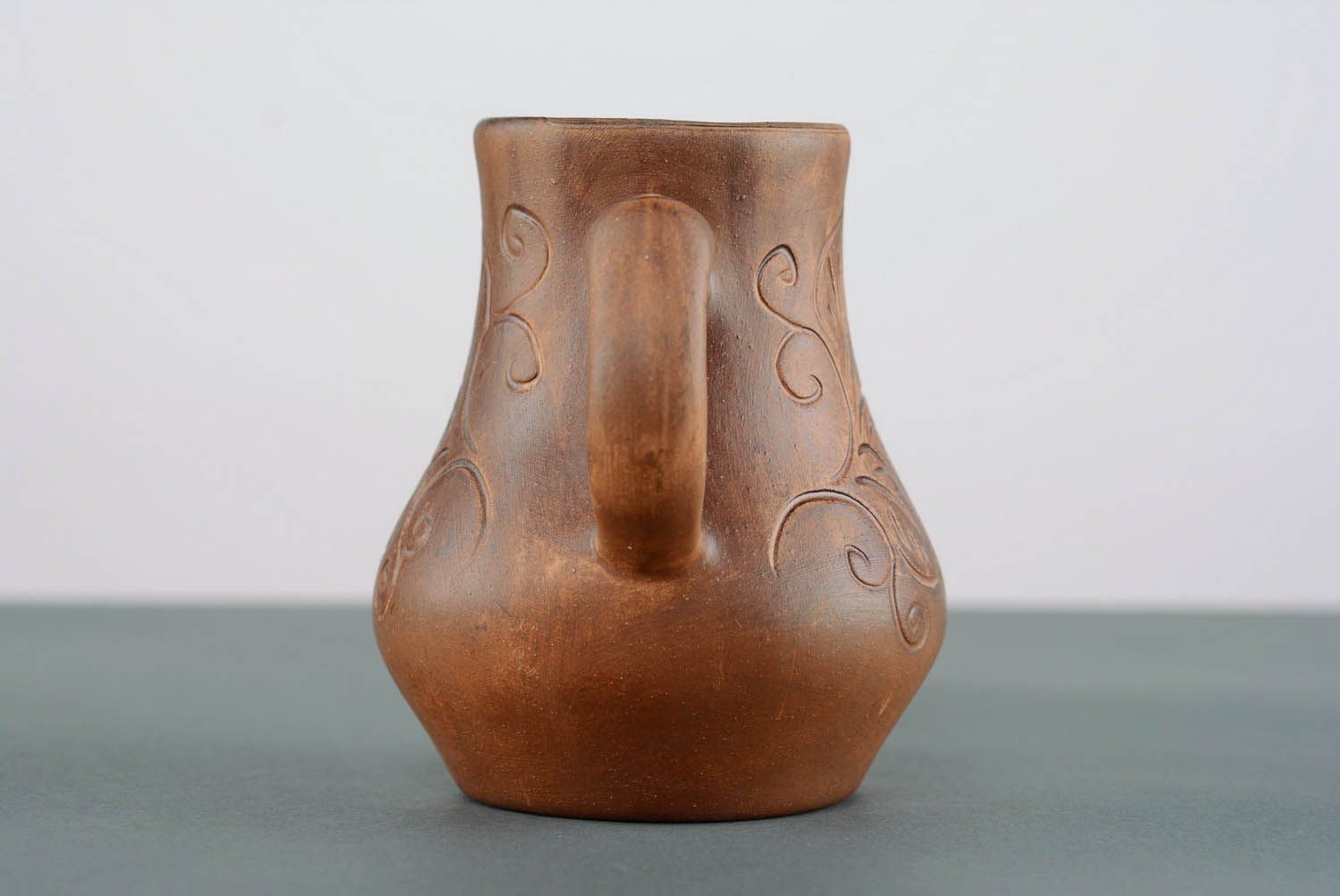 A small jug with patterns.