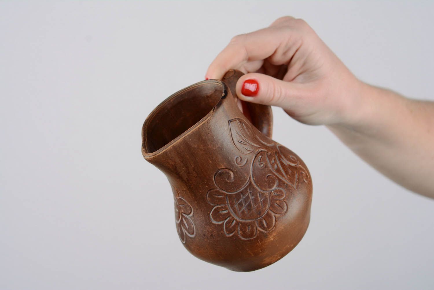 A small jug with patterns.