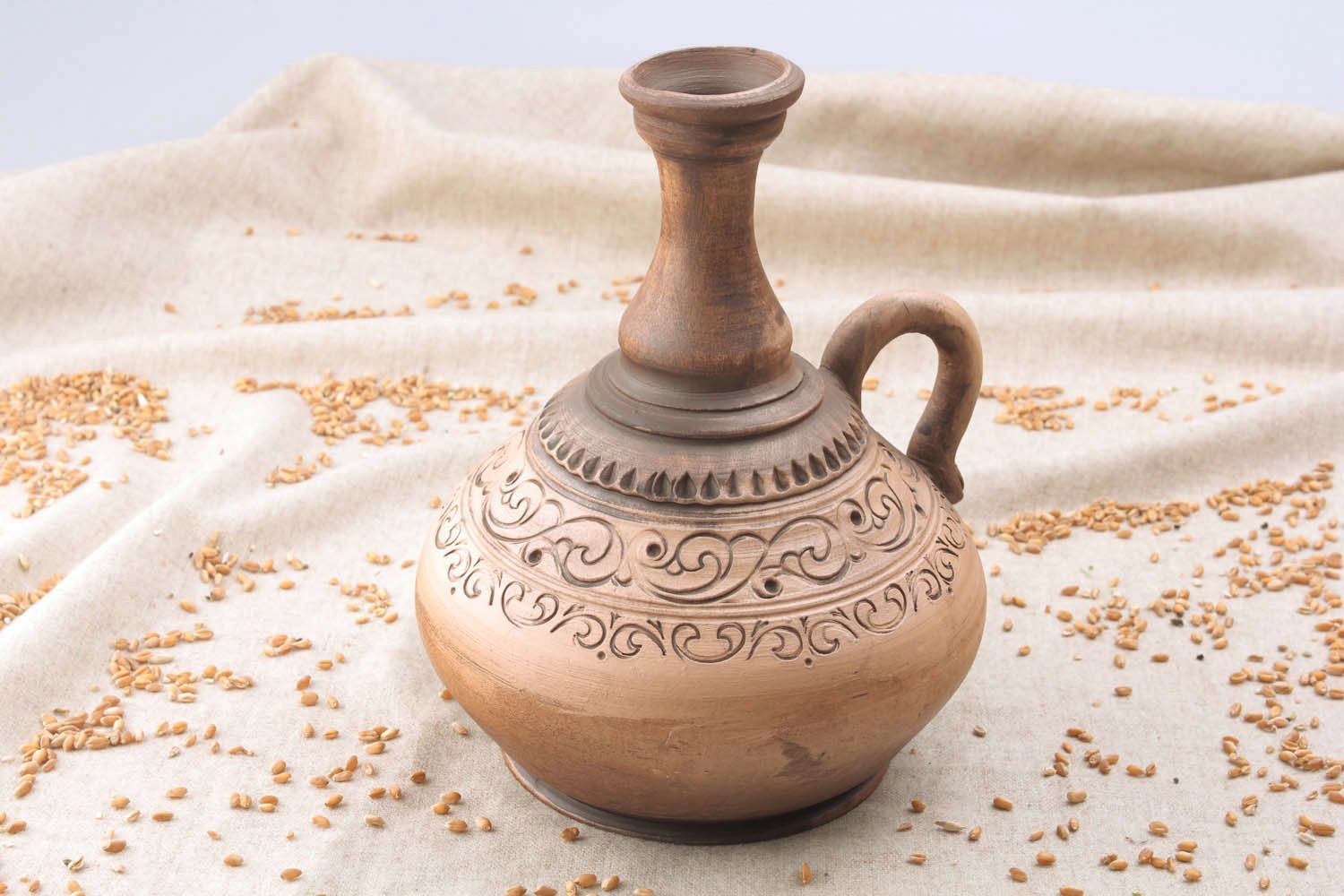 Ceramic wine jug with ornaments