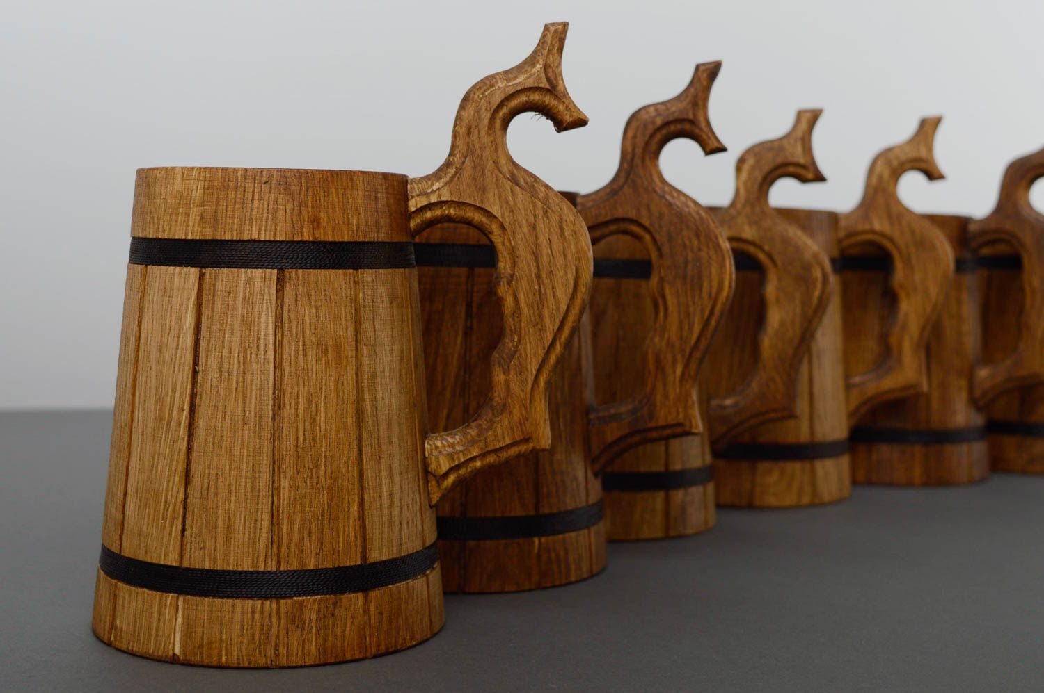 A set of handmade wooden beer mugs.