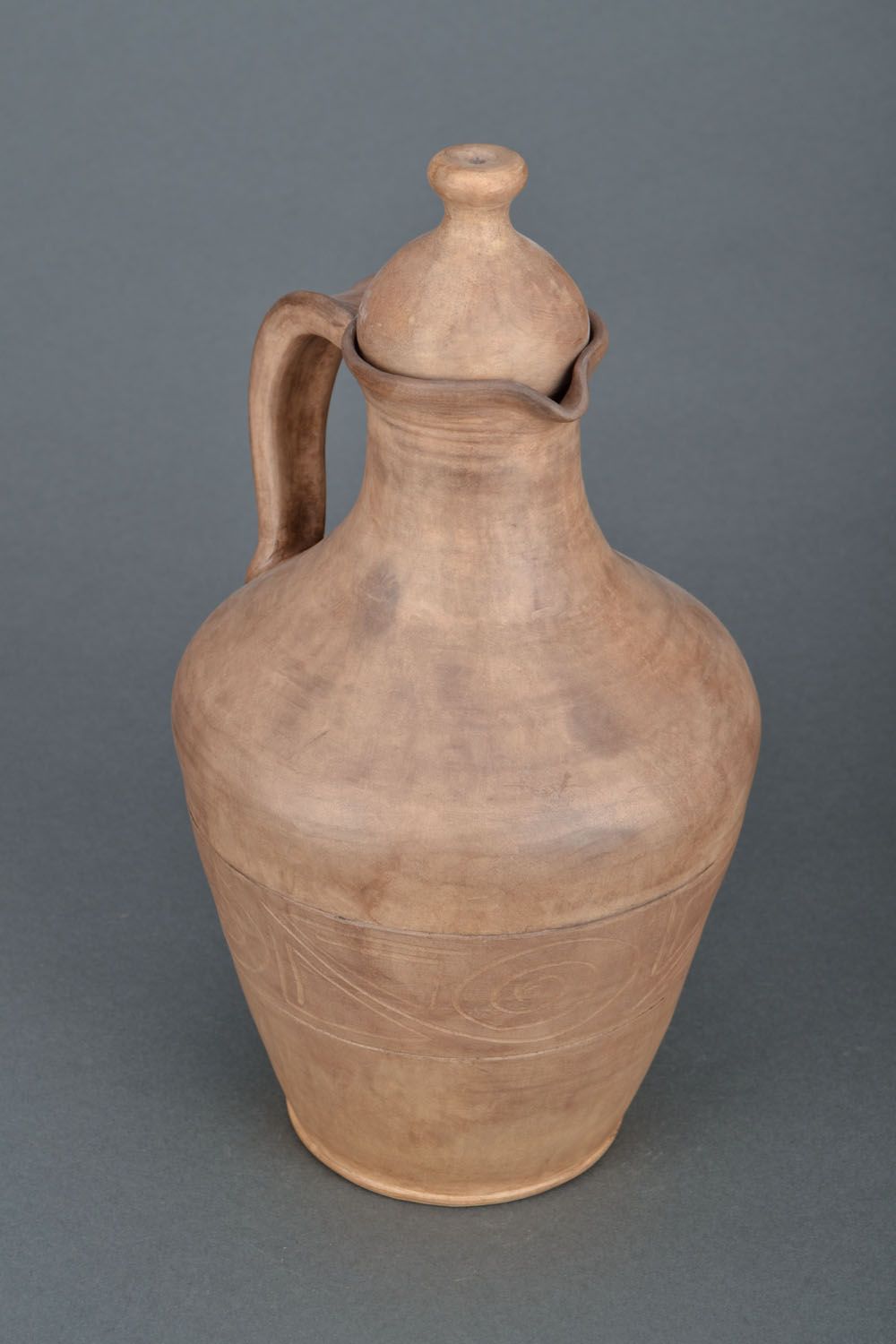 The clay jug is made manually.