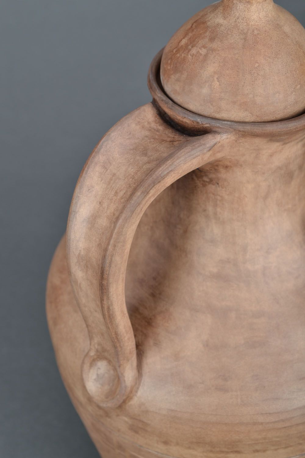 The clay jug is made manually.