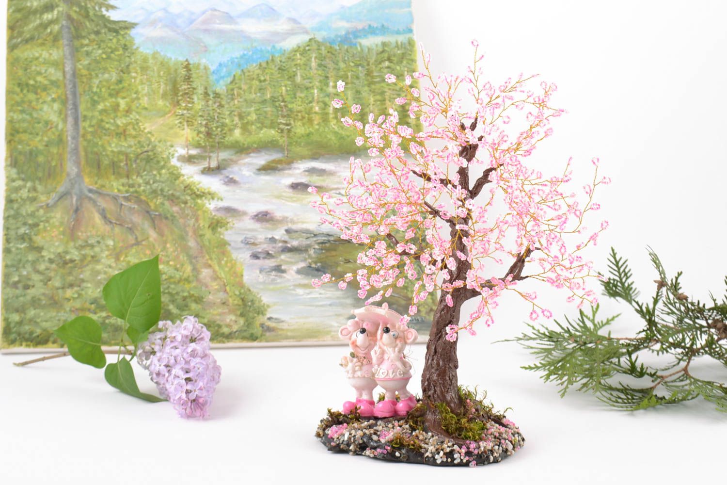 Pink cherry bead tree with mouse figures.