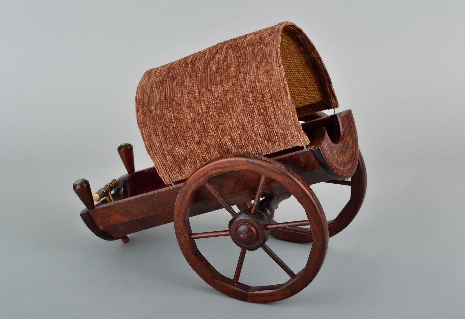 Wine stand in the form of cart, made of wood