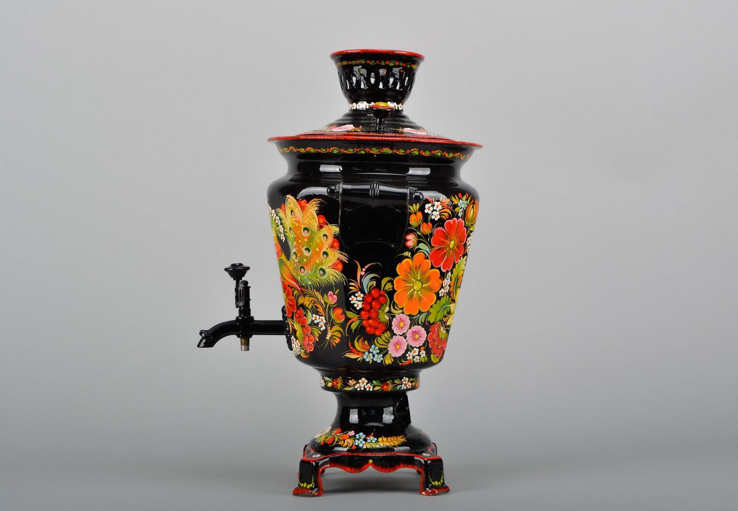 Electric samovar with hand painted patterns.