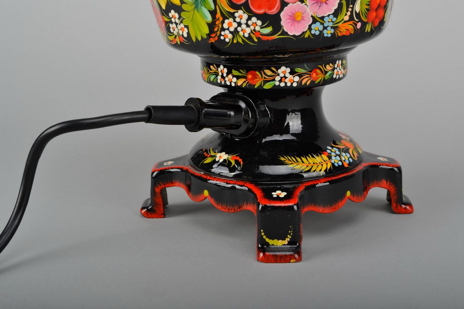 Electric samovar with hand painted patterns.